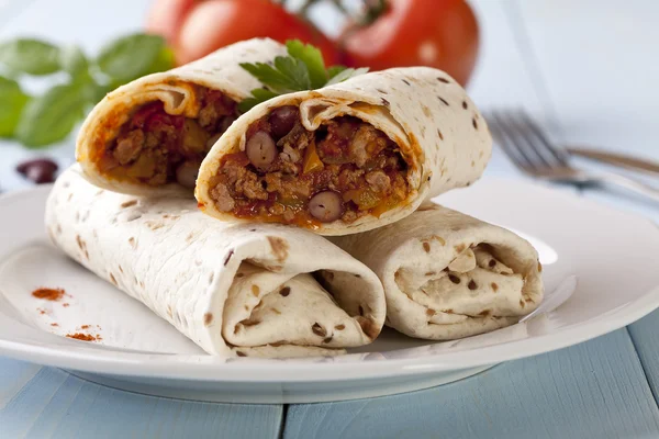 Burritos wraps with meat beans and vegetables — Stock Photo, Image