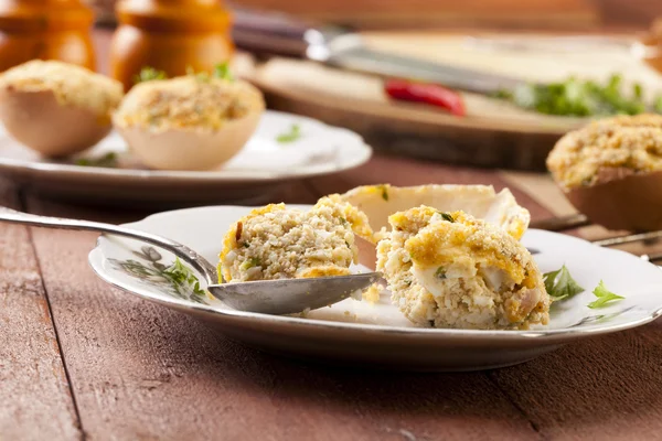 Baked eggs, stuffed with ham and parsley — Stock Photo, Image