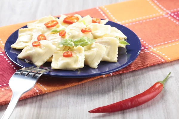 Portion of ravioli with red pepper — Stock Photo, Image