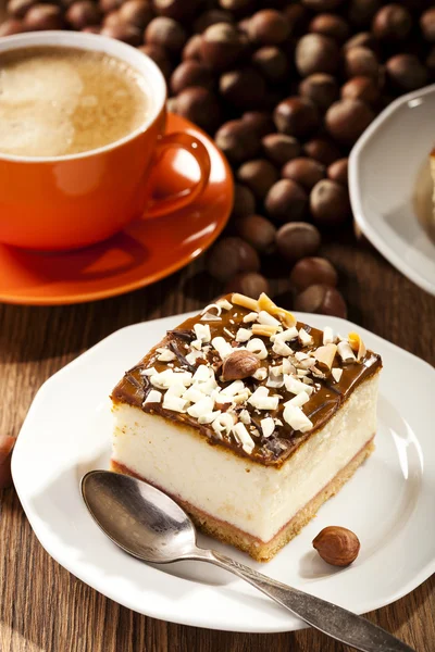 Cheesecake with nuts on plate — Stock Photo, Image