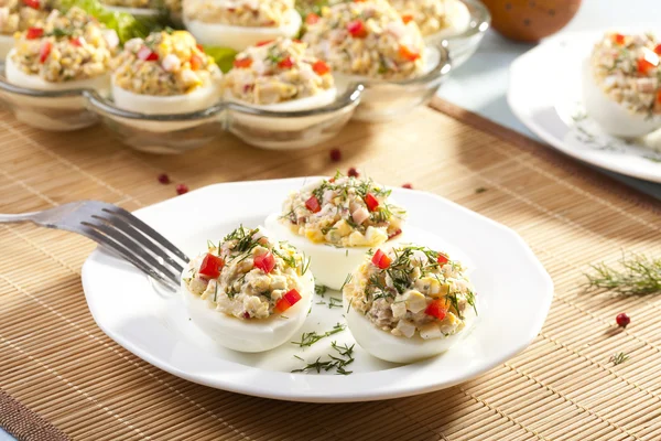 Stuffed eggs with ham, red pepper and dill — Stock Photo, Image