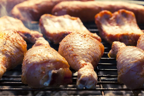 Sausage, raw ribs and chicken with barbecue — Stock Photo, Image