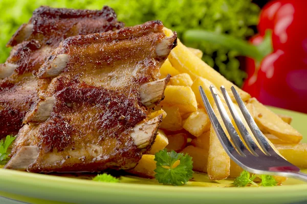 Grilled ribs on plate — Stock Photo, Image