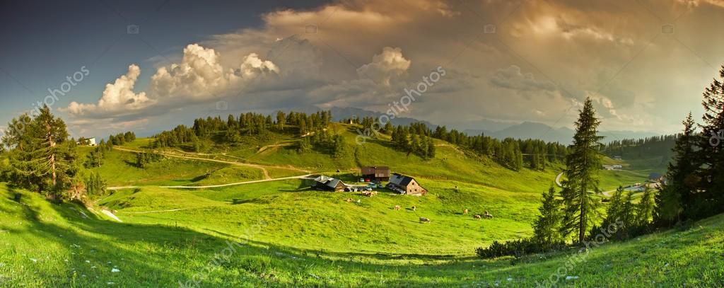 Panorama of the mountains with the sky covered by the clouds.
