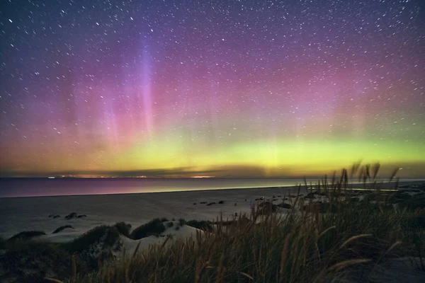 Northern Lights Aurora Borealis over danish Coast. High quality photo