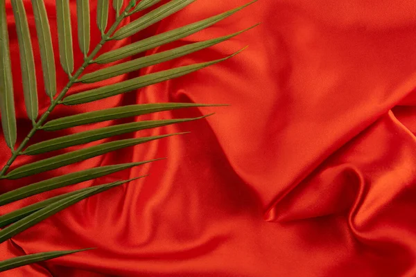 Red Silk Fabric Background Palm Branch Ideal Product Presentation — Fotografie, imagine de stoc