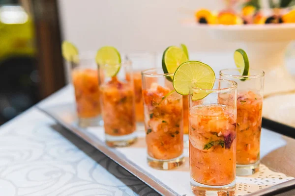tray with lemon shrimp cocktail glasses