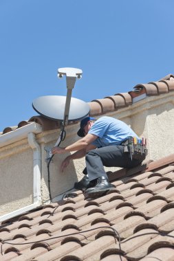 Satellite Installer on Roof clipart