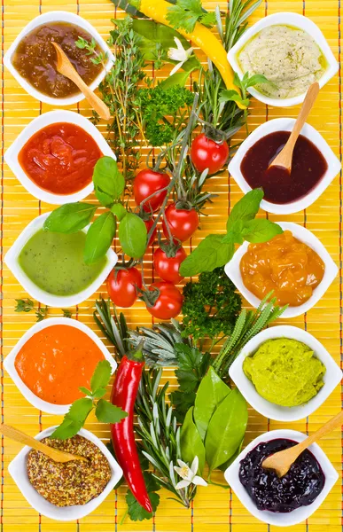 Fresh vegetables and herbs and cooking sauces — Stock Photo, Image