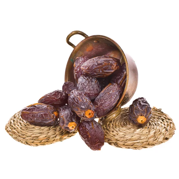 Dried dates in a copper basin — Stock Photo, Image