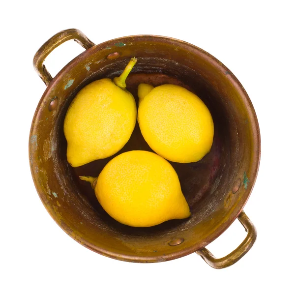 Fresh lemons in copper bowl isolated on white background — Stock Photo, Image