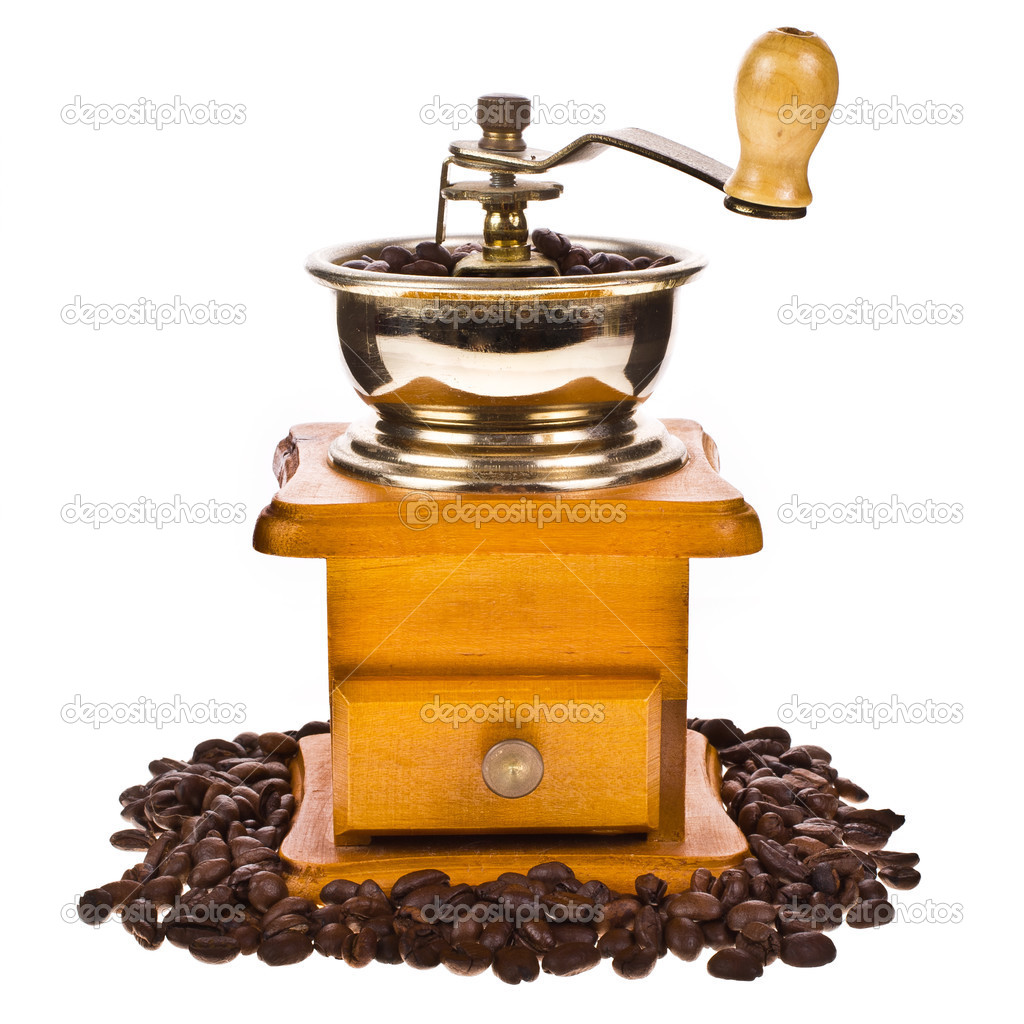 Coffee beans and vintage coffee mill isolated on white background