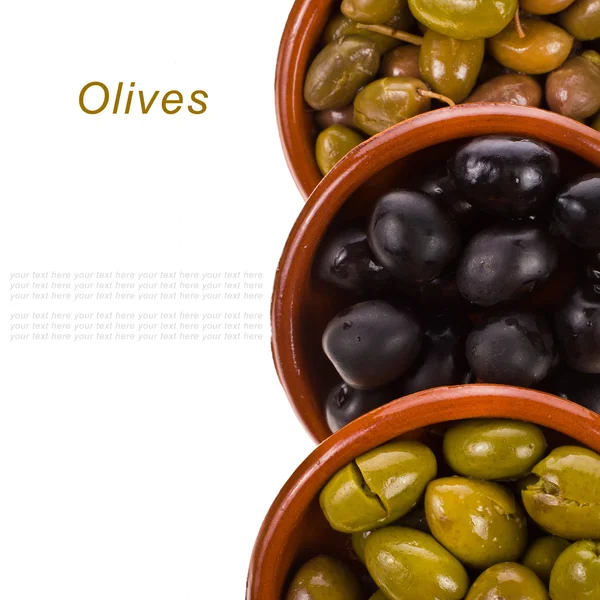 Different varieties of olives marinated in traditional clay bowls isolated on white background — Stock Photo, Image