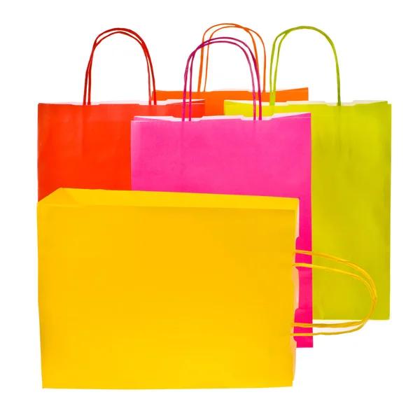 Bolsas de compras de papel de colores brillantes aisladas sobre fondo blanco — Foto de Stock