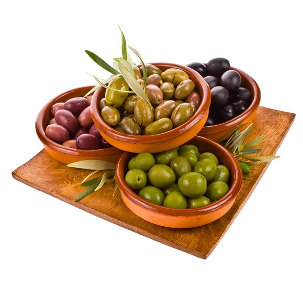 Different varieties of olives marinated in traditional clay bowls — Stock Photo, Image