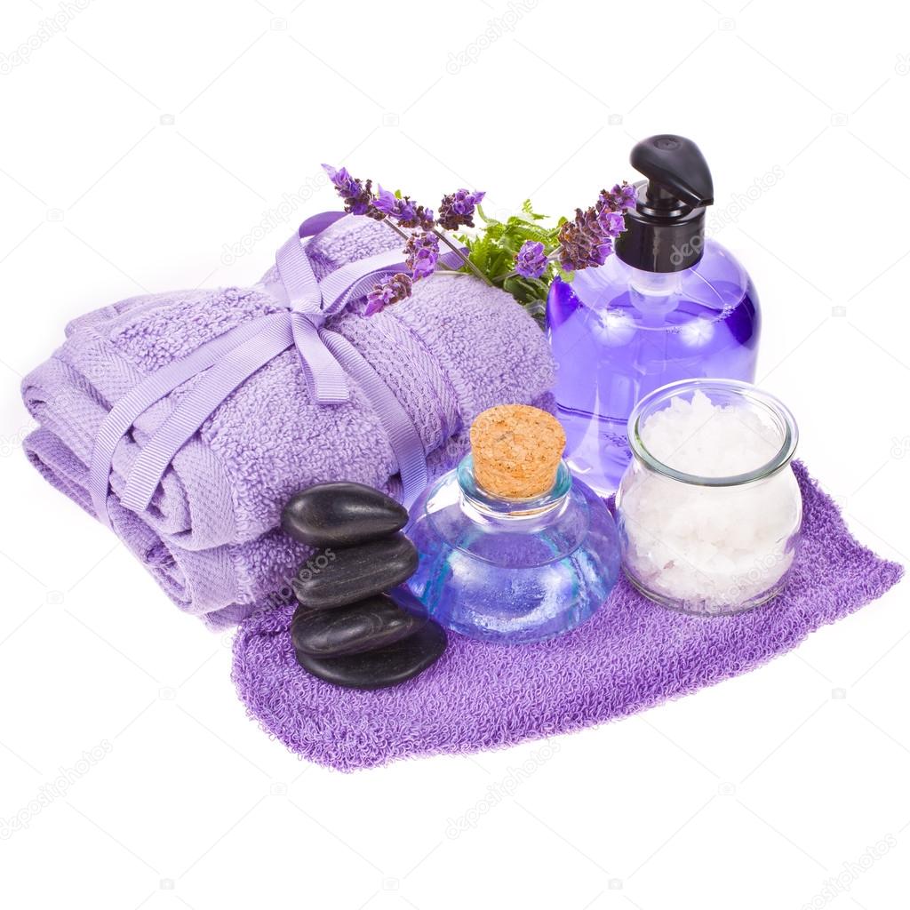Spa concept - towels and lavender flowers and stones