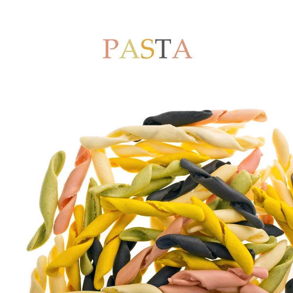 Closeup multicolored pasta scattered — Stock Photo, Image