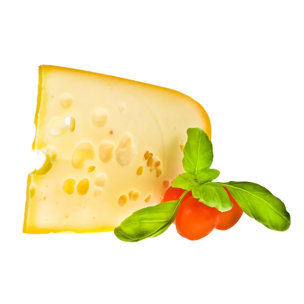 Pieza de queso emmental decorada con tomates cherry —  Fotos de Stock