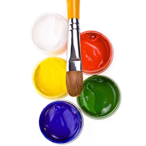 Jars with gouache and paint brush — Stock Photo, Image