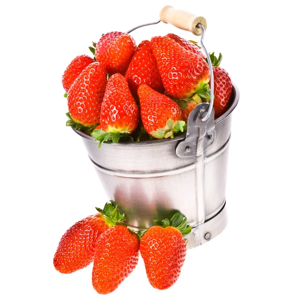 A lot of fresh strawberries and a pail . — Stock Photo, Image