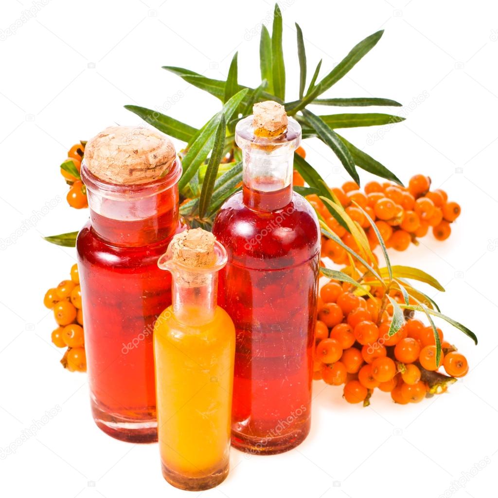 Bottles with oil and juice of sea buckthorn