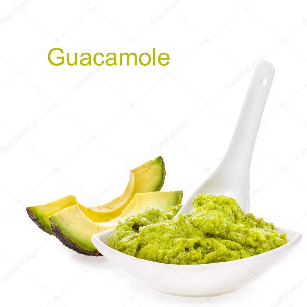 Fresh guacamole in a white bowl with a spoon