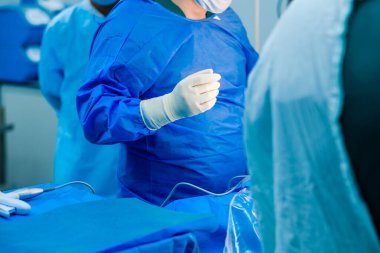 The doctor is ready to start the surgery.