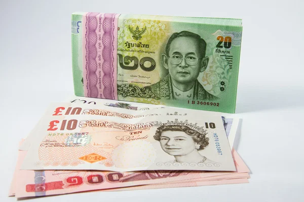 Pound sterling and baht money. — Stock Photo, Image
