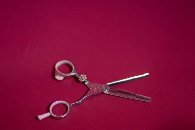 barbers metal scissors lie on the background