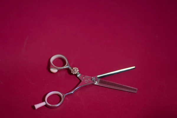 Barbers metal scissors lie on the background — 图库照片