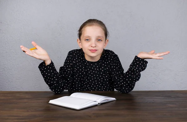 Cheerful European Girl Girl Does Her Homework While Sitting Table — Stock Photo, Image