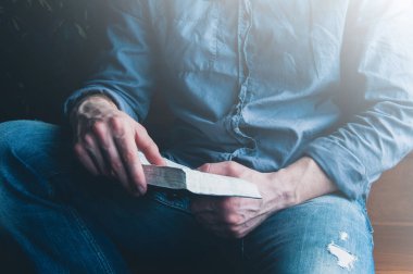 Open bible pray. Holy Bible in the hands of a man. Prayer is praying.