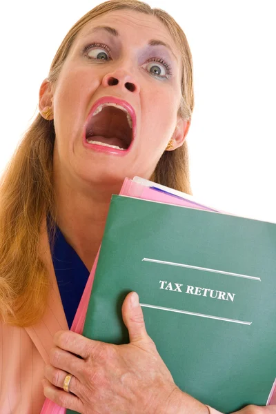 Femme d'affaires frustrée faisant des impôts Photo De Stock