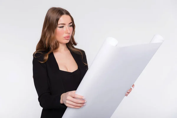 Young Business Woman Opened View Blueprints Layout Her Hands Considers — Stockfoto