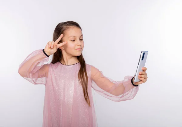 Kid Girl Wearing Pink Dress Blows Air Kiss Camera Smartphone — Stock Photo, Image