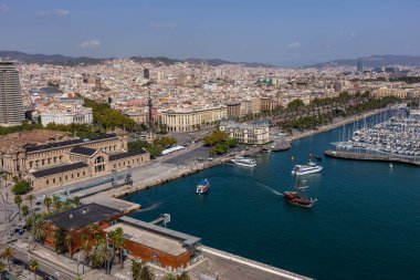 Barcelona, Catalonia Spain - 24.09.2021: Aerial view of the city from the overhead cable car, which crosses Port Vell, Barcelona's old harbour.