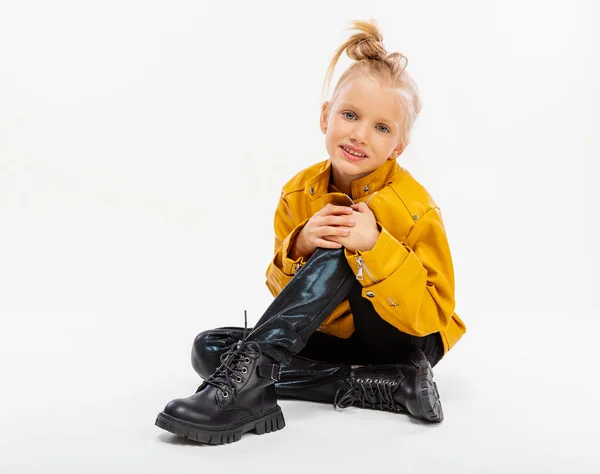 Pretty Blonde Little Girl Sitting Studio Floor Leather Mustard Jacket — Stock fotografie