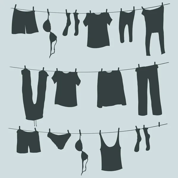 在一根绳子上的洗衣的剪影 — 图库矢量图片