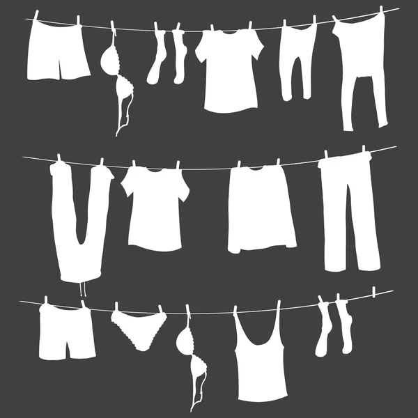 Siluetas blancas de lavandería en una cuerda — Vector de stock