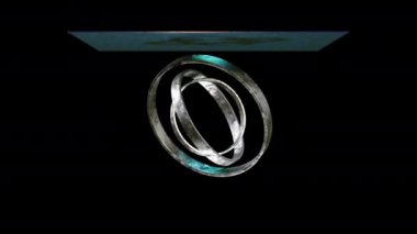 Yanardöner kumaşın üç boyutlu animasyonu farklı boyutlardaki halkaların üzerine koyu arkaplana karşı düşüyor