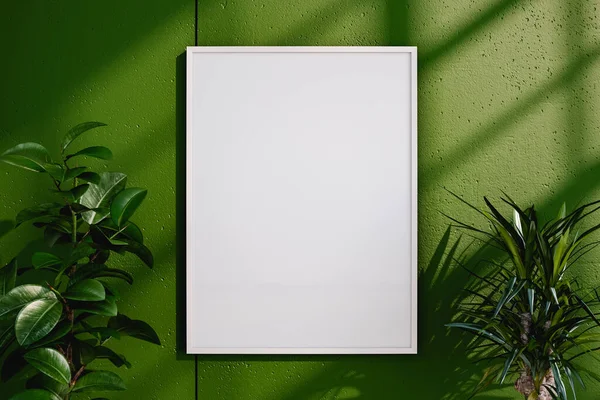 Empty frame hanging on green wall near potted plants with green leaves in daytime. Mock up. 3d render