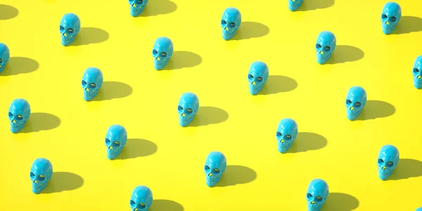 3D illustration of bright blue human skulls forming seamless pattern on yellow background