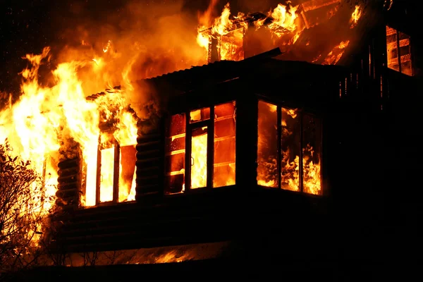 Windows of the burning house — Stock Photo, Image