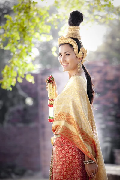 Woman wearing typical thai dress with thai style temple background — Stock Photo, Image