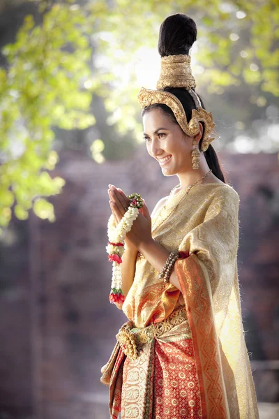 Woman wearing typical thai dress with thai style temple background — Stock Photo, Image