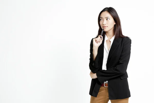 Portrait of young businesswoman with a pen in her hand — Stock Photo, Image