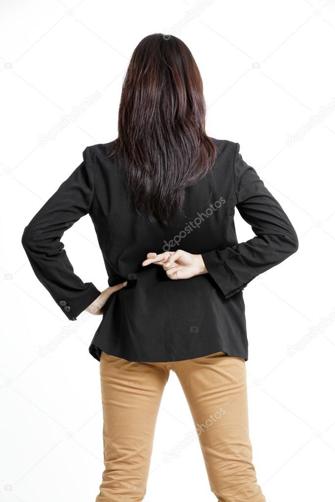 Businesswoman with crossed fingers