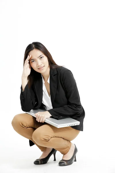 Young businesswoman holding her laptop and keep thinking — Stock Photo, Image