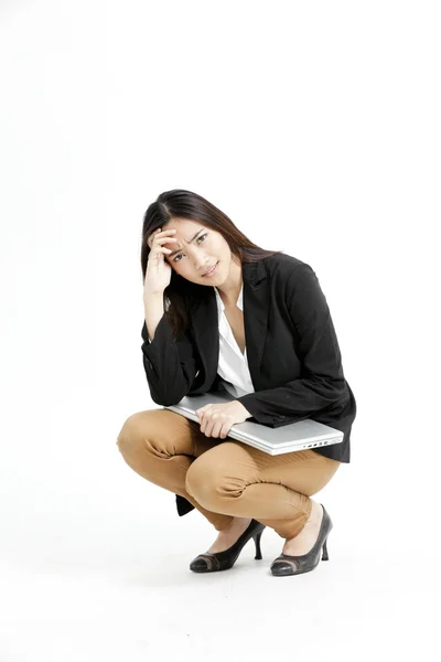 Young businesswoman holding her laptop and keep thinking — Stock Photo, Image