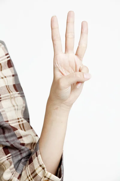 Женщина показывает знак руки — стоковое фото